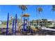 Community playground with slides, swings, and climbing structures, perfect for Gathering fun under the Florida sunshine at 611 Destiny Dr # 604, Ruskin, FL 33570