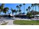 Resort-style poolside restaurant with thatched roof and lush landscaping, creating a relaxing tropical ambiance at 611 Destiny Dr # 604, Ruskin, FL 33570