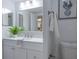 Bright bathroom features a modern vanity, framed mirror, and minimalist decor at 7321 Central Ave # 402, St Petersburg, FL 33710
