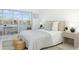Bedroom featuring a bed, neutral decor, natural light, and access to the balcony at 7321 Central Ave # 402, St Petersburg, FL 33710