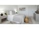 Bedroom featuring a bed, neutral decor and bedside tables with lamps at 7321 Central Ave # 402, St Petersburg, FL 33710