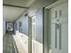 Exterior hallway view showcasing unit doors and outdoor lighting at 7321 Central Ave # 402, St Petersburg, FL 33710