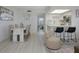 Well-lit living room with an open layout, flowing into the dining and kitchen areas at 7321 Central Ave # 402, St Petersburg, FL 33710