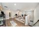 Spacious landing area featuring wood floors and lots of light at 7673 Yale Harbor Dr, Wesley Chapel, FL 33545