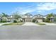 A neighborhood street view showing houses with well-kept lawns at 7673 Yale Harbor Dr, Wesley Chapel, FL 33545