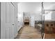 Large primary bathroom showing wood floors, soaking tub, and a glass shower at 7721 Roma Dune Dr, Wesley Chapel, FL 33545