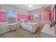 Charming bedroom with bright pink accent walls, white furniture, and two large windows at 7721 Roma Dune Dr, Wesley Chapel, FL 33545