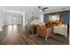 Spacious living room with tile floors, stylish seating, and modern accents at 7721 Roma Dune Dr, Wesley Chapel, FL 33545