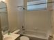 Full bathroom featuring white tiled walls, shower, and white vanity at 8019 Brien Green Way, Temple Terrace, FL 33637