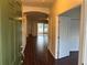 Welcoming entryway showcasing hardwood floors, arched doorways, and an open floor plan at 8019 Brien Green Way, Temple Terrace, FL 33637