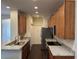 Kitchen with stainless steel appliances, granite countertops, and wood flooring at 8019 Brien Green Way, Temple Terrace, FL 33637