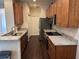 Spacious kitchen with wood cabinets, granite countertops, and stainless steel appliances at 8019 Brien Green Way, Temple Terrace, FL 33637