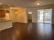 Living room with open floorplan leading to kitchen and enclosed patio area at 8019 Brien Green Way, Temple Terrace, FL 33637