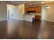 Open-concept living room with a view of the kitchen featuring tile floors at 8019 Brien Green Way, Temple Terrace, FL 33637