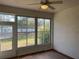Sunroom featuring brick tile floor with a large window to the back yard at 8019 Brien Green Way, Temple Terrace, FL 33637