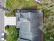 Birds eye view of the home showcasing the roof, driveway and surrounding landscaping at 887 Lucas Ln, Oldsmar, FL 34677