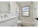 Bathroom featuring tiled shower/bath and updated vanity at 887 Lucas Ln, Oldsmar, FL 34677