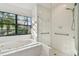 Bright bathroom with a large soaking tub, walk-in shower at 887 Lucas Ln, Oldsmar, FL 34677
