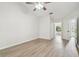 Bedroom featuring wood look floors and multiple doors at 887 Lucas Ln, Oldsmar, FL 34677