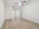 Bedroom featuring wood look floors and a ceiling fan at 887 Lucas Ln, Oldsmar, FL 34677