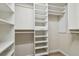 Spacious walk-in closet with custom shelving and ample storage space for an organized wardrobe at 887 Lucas Ln, Oldsmar, FL 34677