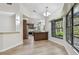 Dining room with hardwood floors, chandelier and view into kitchen with bar top counter at 887 Lucas Ln, Oldsmar, FL 34677
