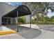 Entrance to the community clubhouse with covered entry for residents at 887 Lucas Ln, Oldsmar, FL 34677