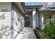 Inviting front entrance with a covered porch, updated door, and manicured landscaping at 887 Lucas Ln, Oldsmar, FL 34677