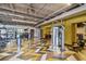 Large gym featuring modern equipment, patterned floors, and a mirrored wall for fitness activities at 887 Lucas Ln, Oldsmar, FL 34677