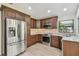 Updated kitchen featuring stainless steel appliances and attractive wood cabinetry at 887 Lucas Ln, Oldsmar, FL 34677