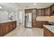 Open kitchen with stainless steel appliances, ample cabinet space, and granite countertops at 887 Lucas Ln, Oldsmar, FL 34677