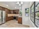 Updated kitchen featuring stainless steel appliances and a view of nature from the window at 887 Lucas Ln, Oldsmar, FL 34677