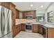 Updated kitchen featuring stainless steel appliances and attractive wood cabinetry at 887 Lucas Ln, Oldsmar, FL 34677