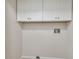 Laundry room with white cabinets and washer and dryer hookups at 887 Lucas Ln, Oldsmar, FL 34677