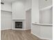 Bright living room featuring a fireplace, updated floors, and natural light at 887 Lucas Ln, Oldsmar, FL 34677