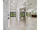 Bright and airy living room with hardwood floors and sliding glass doors with views of the backyard at 887 Lucas Ln, Oldsmar, FL 34677
