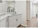 Bright wet bar featuring white cabinets, quartz counters, and modern faucet fixtures at 887 Lucas Ln, Oldsmar, FL 34677