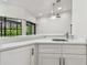 Close up of new wet bar in the living room, with white cabinets and granite countertop at 887 Lucas Ln, Oldsmar, FL 34677