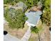 Aerial view of a single-Gathering home with mature landscaping and long driveway at 8979 Hernando Way, Weeki Wachee, FL 34613