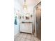 Nautical themed bathroom featuring stylish vanity, decorative mirror, and glass enclosed shower at 8979 Hernando Way, Weeki Wachee, FL 34613