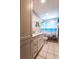 Bathroom featuring white vanity with marble countertop and beach themed decor at 8979 Hernando Way, Weeki Wachee, FL 34613