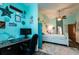 Bedroom connected to the office space, with white furniture and beach themed bedding at 8979 Hernando Way, Weeki Wachee, FL 34613