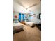 Charming bedroom featuring two twin beds, blue walls, and ceiling fan at 8979 Hernando Way, Weeki Wachee, FL 34613