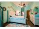 Bedroom with white furniture, hardwood floors and coastal themed bedding at 8979 Hernando Way, Weeki Wachee, FL 34613
