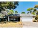 Charming single-story home with a well-maintained lawn and attached two-car garage at 8979 Hernando Way, Weeki Wachee, FL 34613