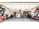 Spacious two car garage with shelving at 8979 Hernando Way, Weeki Wachee, FL 34613