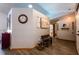 Spacious hallway with wood-look flooring, stylish decor, and access to multiple rooms at 8979 Hernando Way, Weeki Wachee, FL 34613