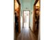 Hallway with two closet doors at 8979 Hernando Way, Weeki Wachee, FL 34613