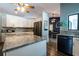 Spacious kitchen with stainless steel appliances, granite countertops, and wood flooring at 8979 Hernando Way, Weeki Wachee, FL 34613