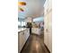 Bright kitchen with stainless steel appliances, granite countertops, and wood flooring at 8979 Hernando Way, Weeki Wachee, FL 34613